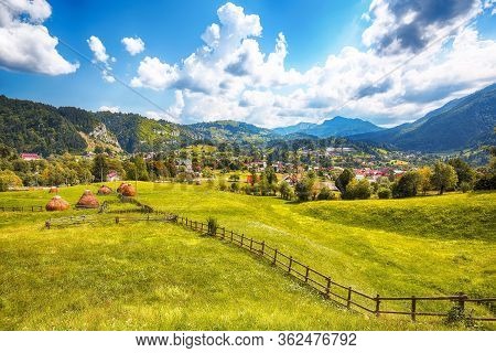 Stunning Alpine Landscape With Green Fields And Piatra Craiului Mountains In Dambovicioara Commune. 