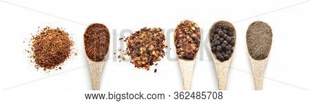 Different Varieties Of Pepper. Red Paprika, Chili, Black, Ground Pepper In Wooden Spoons. Complect, 