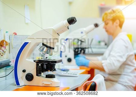 Laboratory Assistants Analyzing Blood Sample. Assistance In Gloves. Prevention. Pneumonia Diagnosing