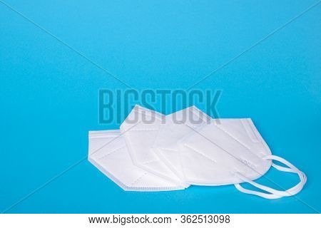 Protective Surgical Ear-loop Kn95 Masks On Blue Background.