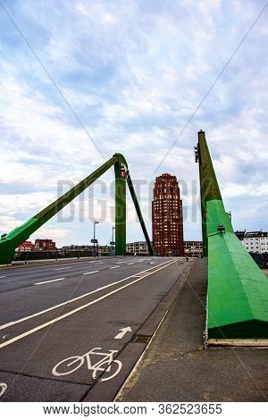 The View Over The Bridge To The 88 Meter High Tower With Dark Red Brick Facade