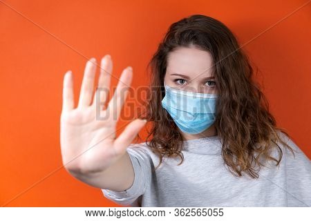 A Young Doctor In A Medical Uniform Makes A Forbidden Gesture With His Hands. Medical Design Concept