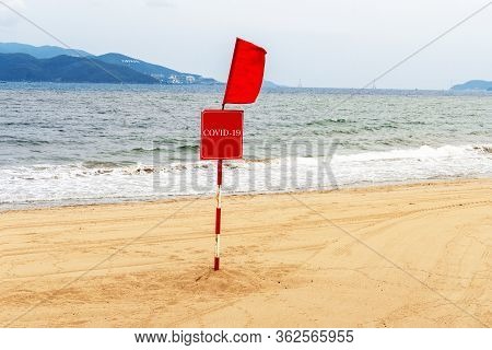 Сlosed Beach Due To Measures To Protect Against Spread Of The Virus Covid-19. A Red Flag And A Warni