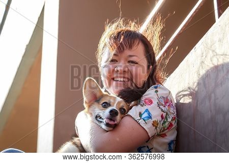 Pretty Funny Girl With Small Nice Dog Big Wall Of City House In A Sunny Day