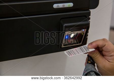 Checking The Price Of The Products On The Scanner At The Grocery Store.target Self Price Scanner Let