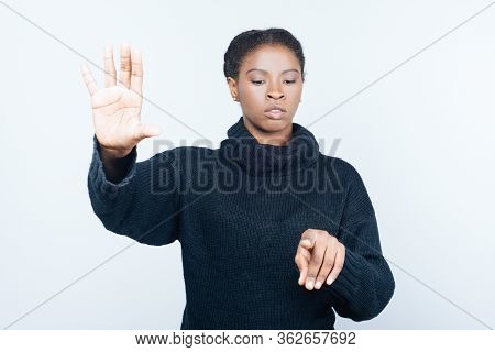 Front View Of Serious Woman Touching Virtual Screen. Attractive Young Lady Pressing Something On Ima