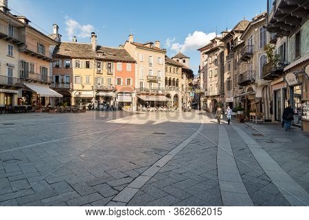 View Of The Market Square Or Piazza Del Mercato With Medieval Buildings, Domodossola, Italy