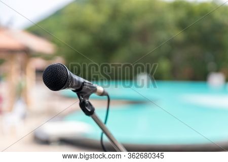 Microphone Outdoor Near Swimming Pools Soft And Blur Style For Background. Microphone Over The Abstr