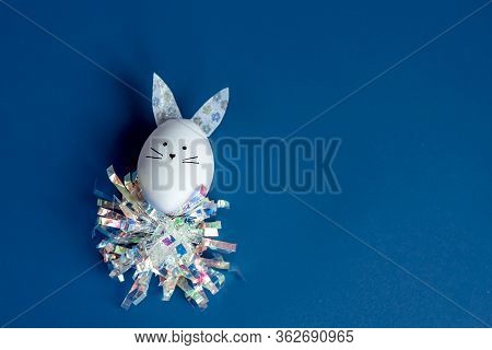 Easter Holiday Concept With Cute Handmade Egg Bunny. Frame With Copy Space For Text. One Easter Egg 