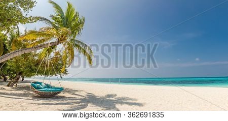 Tropical Beach Panorama As Summer Landscape With Beach Swing Or Hammock And White Sand And Calm Sea 