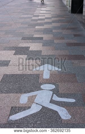 Symbols Walk In This Direction, On The Street Along The Covid-19 In Escaldes Engordany In Andorra.