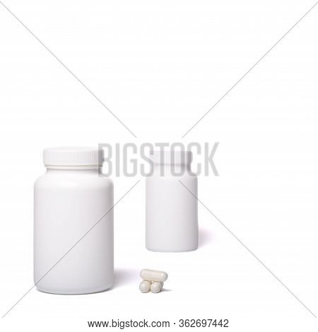 Two White Containers With No Logo And Pilules On A White Background.