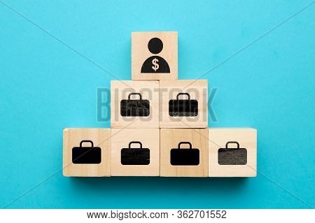 Shareholder Concept - Abstract Person With Cases On Wooden Cubes. Close Up.