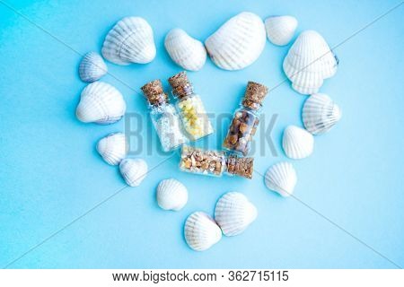 Picture With Soft Focus Of Four Tiny Glass Jar With Buckwheat, Millet, Sugar And Barley Surrounded B