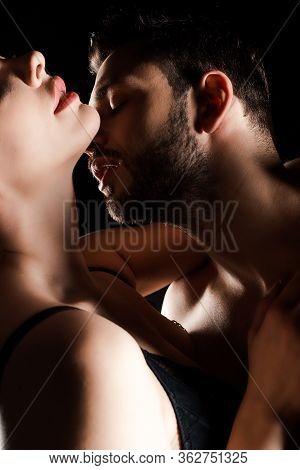 Cropped View Of Seductive Girl Embracing With Sexy Man Isolated On Black