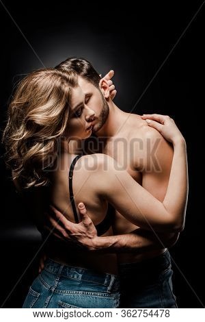 Sexy Young Couple Hugging With Closed Eyes On Black Background