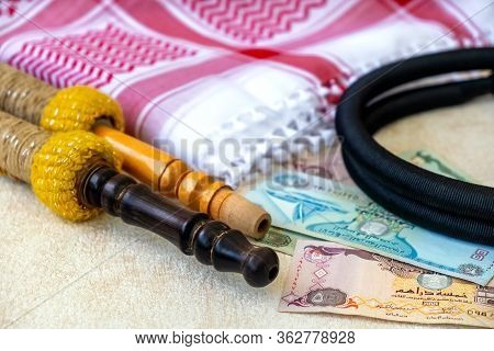 Close-up Set Of Arab Scarf Shawl Keffiyeh Or Kafiya, Igal Or Agal, Arabian Money Dirhams And Hookah 