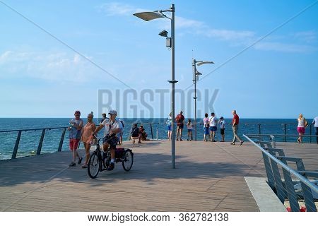 Rewal, Poland - September 01, 2019: Tourists On A Viewing Platform On The Beach Of The Polish Baltic