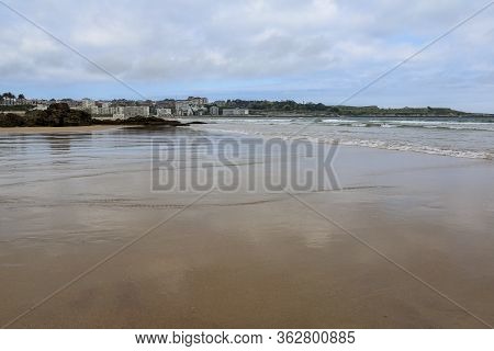 Sardinero Beach On A Day At Low Tide And Some Clouds, Santander, Cantabria, Spain.