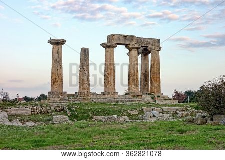 Temple Of Apollo In Archaological Site Of Corinth And After Sunset In Greece, Eu