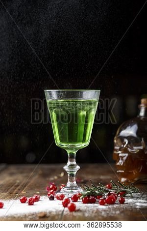 Absinthe Is Poured Into A Beautiful Old Glass, Stands On The Bar Counter. Sugar Is Beautifully Sprin