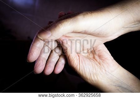 Hands Of Elderly Woman Doing A Selfmassage. Manual Physiotherapy