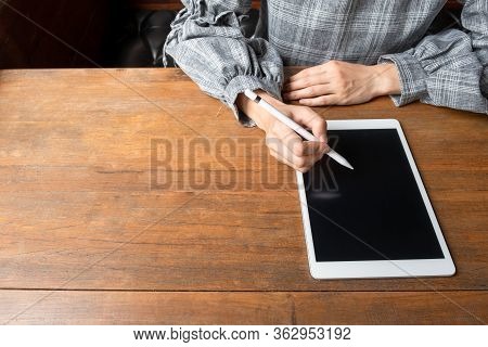 Picture Of Business Woman Working At Home With Her Tablat.