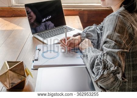 Business Woman Working At Home With Her Laptop And Tablat.