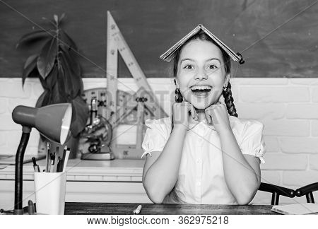 Hometask Concept. Girl Cute Child Sit School Classroom Chalkboard Background. Small Kid Study School