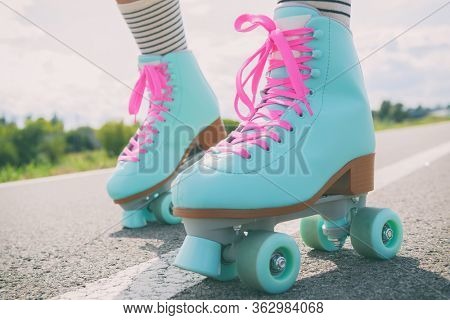 Woman rollerskater wearing roller skates with pink laces