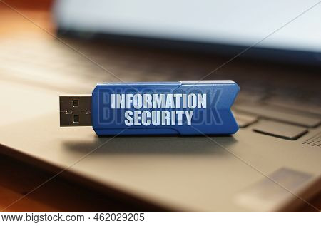 Computer And Security Concept. On The Laptop Keyboard Is A Flash Drive With The Inscription - Inform