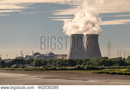 Antwerpen, Flanders, Belgium - July 10, 2022: Cooling Towers And Doel Nuclear Power Plant Behind Sch