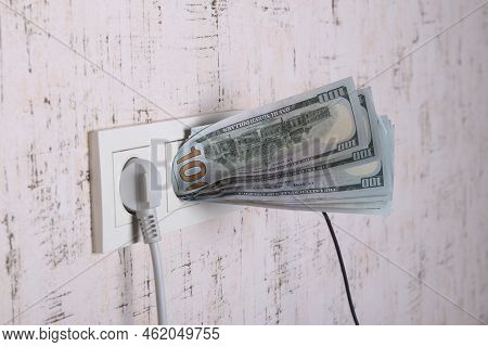 Socket And Switch In The Wall. 100 Is In It. Tariff Growth. Saving Electricity