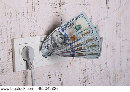 Socket And Switch In The Wall. 100 Is In It. Tariff Growth. Saving Electricity