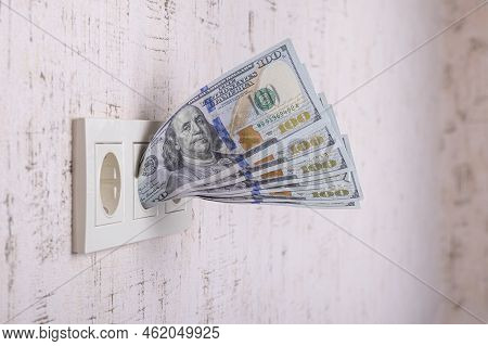 Socket And Switch In The Wall. 100 Is In It. Tariff Growth. Saving Electricity