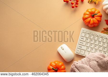 Autumn Office Workspace. Keyboard, Laptop, Notebok With Autumn Clothes And Fall Decorations - Pumpki