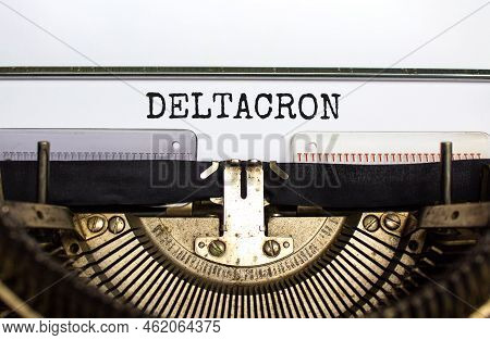 Covid-19 Corona Deltacron Symbol. The Concept Word Deltacron Typed On Retro Typewriter. Beautiful Wh