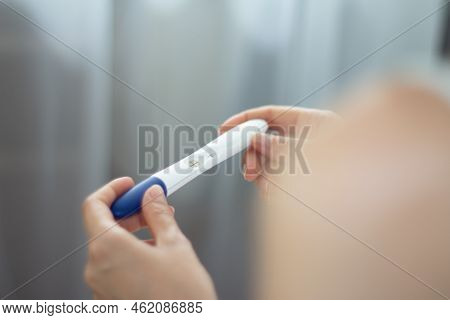 Pregnancy Test In Hands. The Test Shows A Positive Result