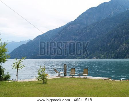 Lounge Chairs At A Mountain Lake On A Cloudy Day - Lake Chelan Wa Usa