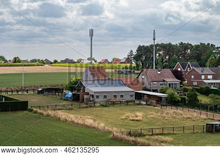 Tielt-winge, Flemish Brabant, Belgium,  08 22 2022 - High Angle View Over Farmhouses And Agriculture