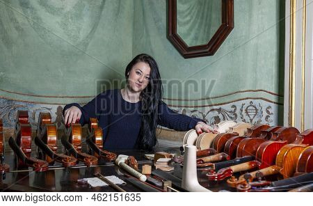 Fascinating Violinist Showing His Collection Of Handcrafted Violins