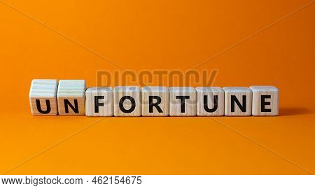Fortune Or Unfortune Symbol. Turned Wooden Cubes And Changed The Concept Word Unfortune To Fortune. 