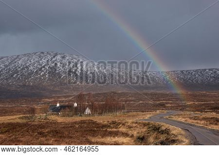 Stunning Landscape Image Of Vibrant Rainbow In Front Of Mountains In Scottish Highlands Rannoch Moor