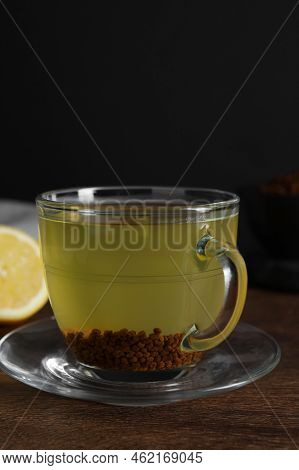 Buckwheat Tea In Cup On Wooden Table, Closeup