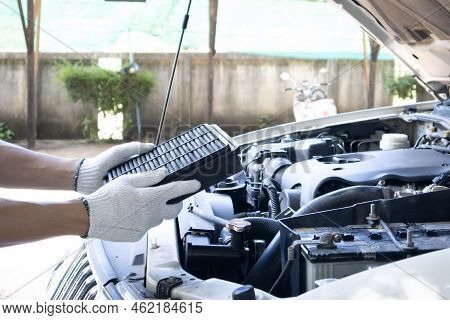 Manual Car Air Filter Replacement To Maintain Engine Performance.air Filter Is Clogged. Causing Inco