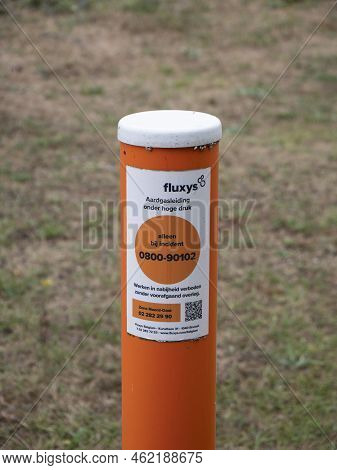 Lillo, Belgium, 31 July 2022, Orange Pole With The Text, Fluxys, Natural Gas Pipeline Under High Pre