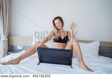 Young Sexy Woman Posing In Front Of Camera And Working As Webcam Model
