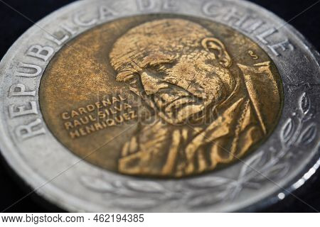 Translation: Republic Of Chile. Coin Of 500 Chilean Pesos Close-up. Peso Of Chile. News About Econom