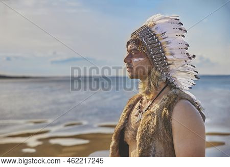 Man In Traditional Native American Clothing Near The Sea