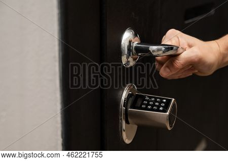 Woman Opens The Combination Lock On The Door To The Apartment. Keyless Entry.